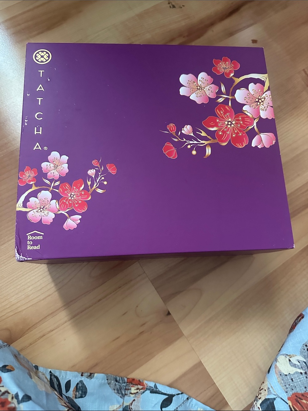 Tatcha Purple Box with Pink and Red Floral Accents skin care products